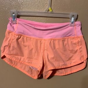 Lululemon pink orange striped shorts 2 flaws
